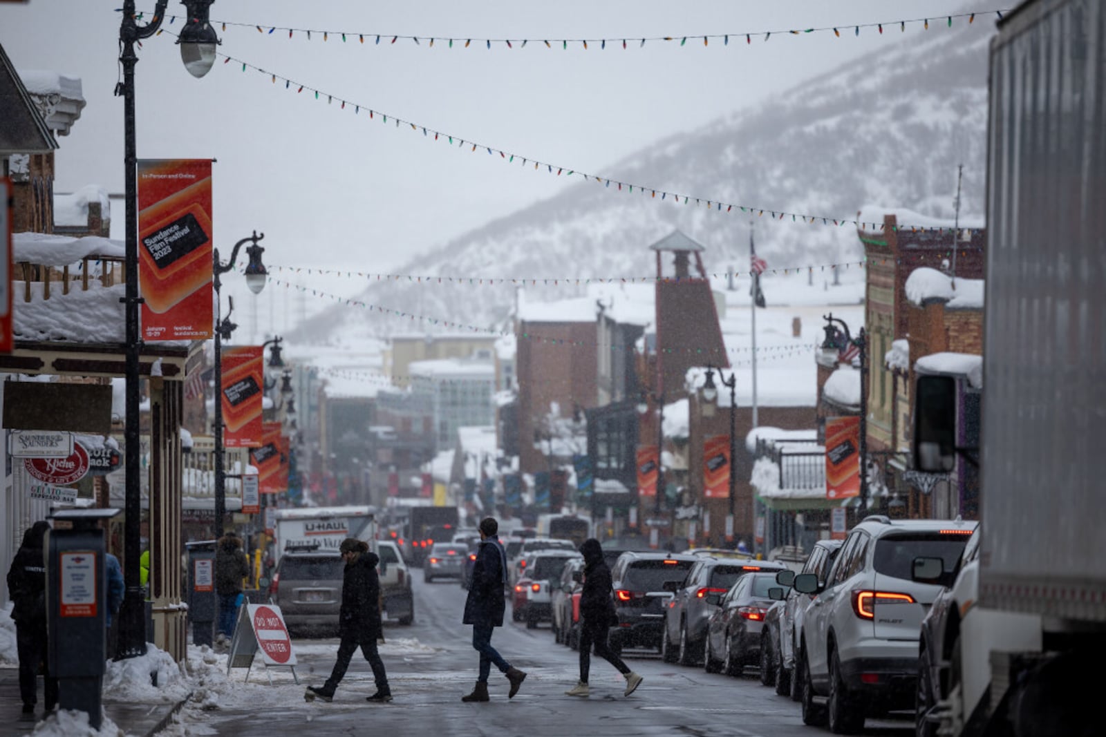 Pedestrians cross Main Street on the opening day of the Sundance Film Festival in Park City. | Photo by Spenser Heaps, Deseret News