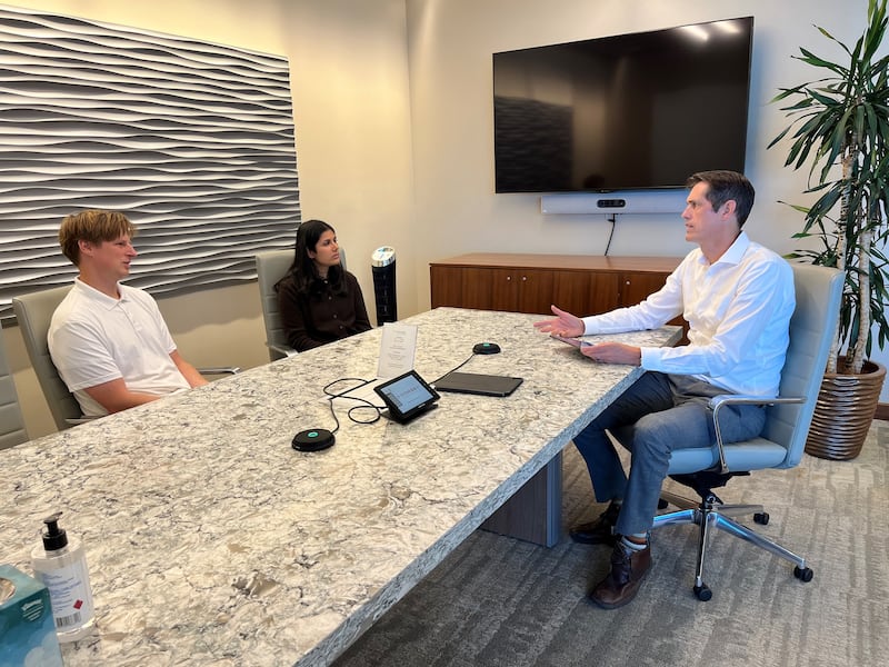 Left to right: Samuel Flitton, Megha Kundra and Troy Keller collaborating on strategic legal solutions in one of Dorsey’s conference rooms.