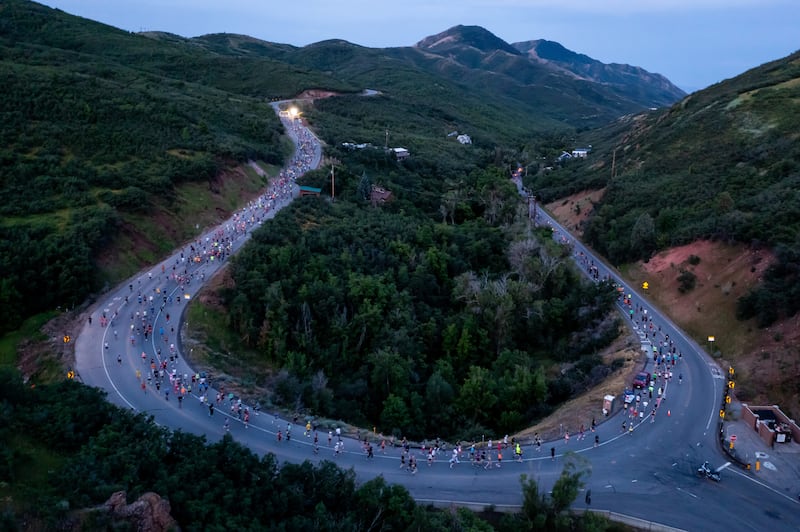 Runners make the first turn in the Deseret News Half Marathon in Emigration Canyon in Salt Lake County on Pioneer Day, Monday, July 24, 2023. | Photo by Spenser Heaps, Deseret News