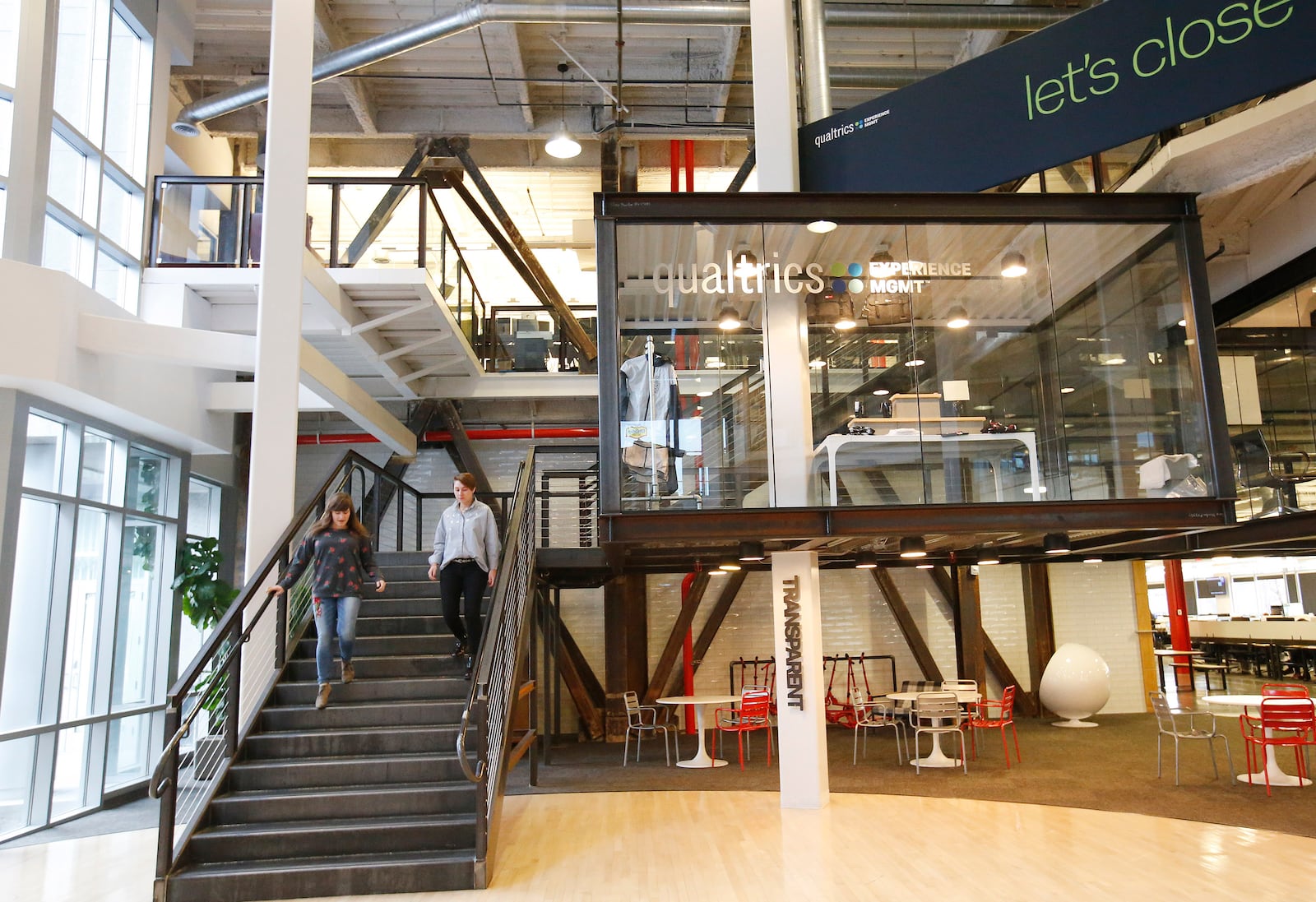 Qualtrics employees walk through the business in Provo. | Photo by Jeffrey D. Allred, Deseret News