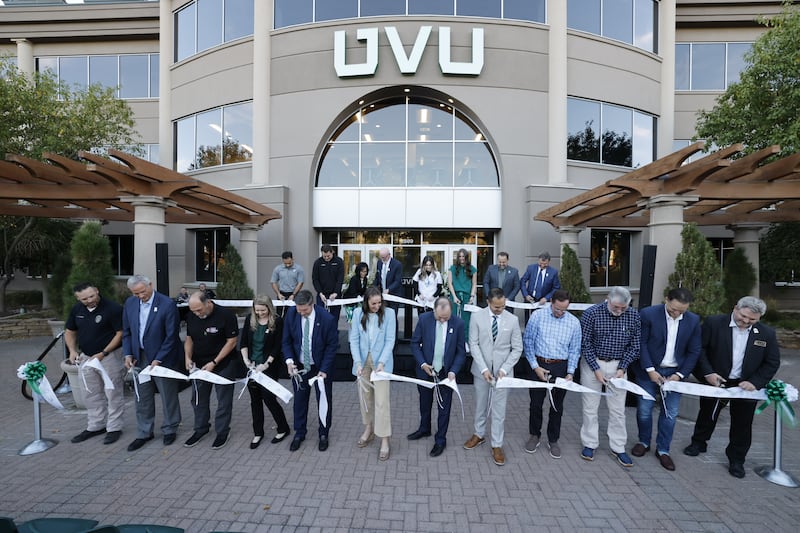 UVU leaders cut ribbon.