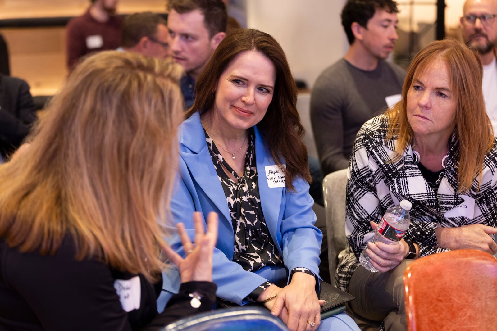 Attendees of Utah Business's Founder Friday Series converse before speaker Aaron Skonnard, co-founder and CEO of Pluralsight, at Kiln SLC in Salt Lake City on Friday, April 19, 2024.