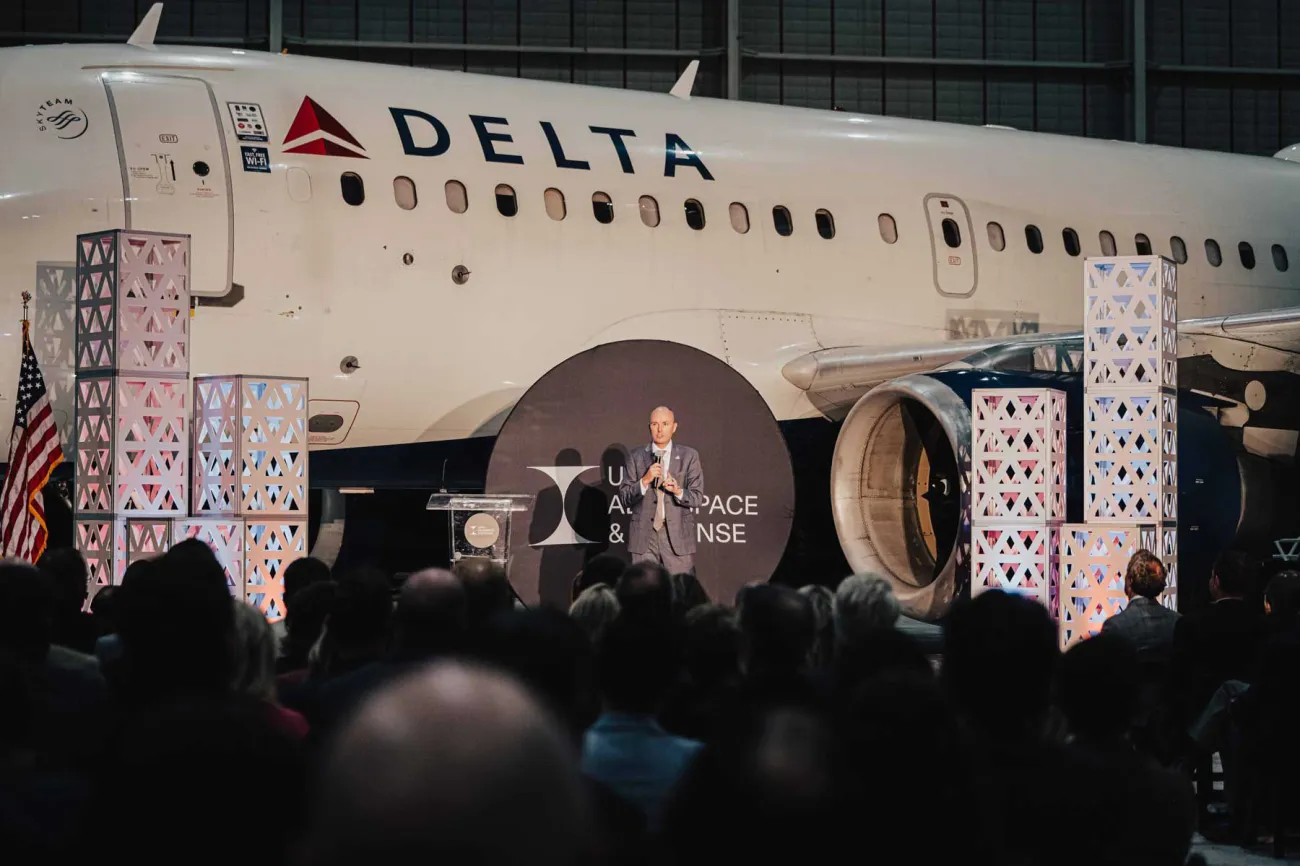 Governor Cox speaks at a 47G event at the Salt Lake City International Airport Delta hangar.