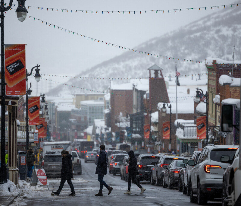 Pedestrians cross Main Street on the opening day of the Sundance Film Festival in Park City. | Photo by Spenser Heaps, Deseret News