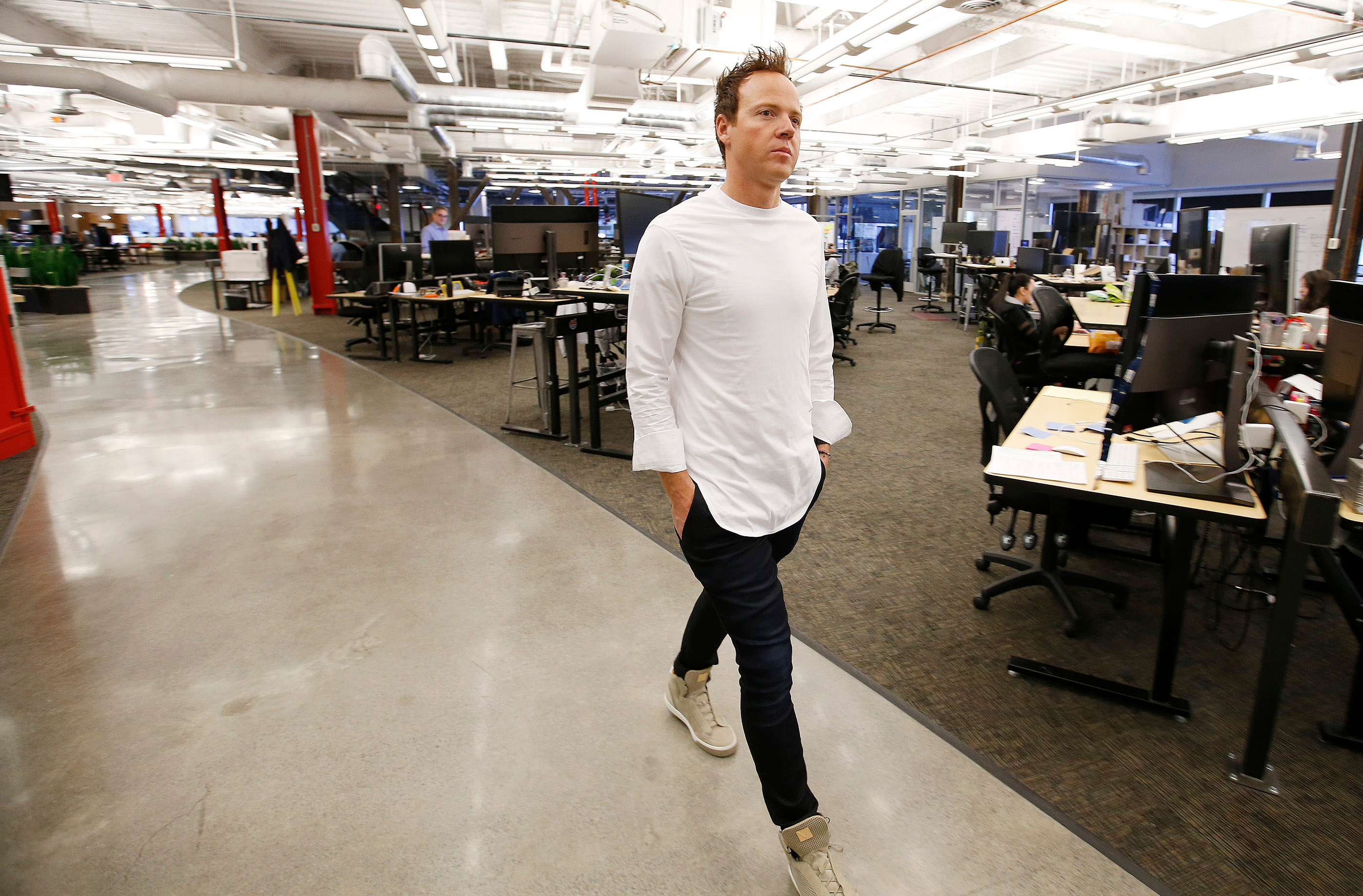 Qualtrics CEO Ryan Smith walks through the office in Provo. | Photo by Jeffrey D. Allred, Deseret News